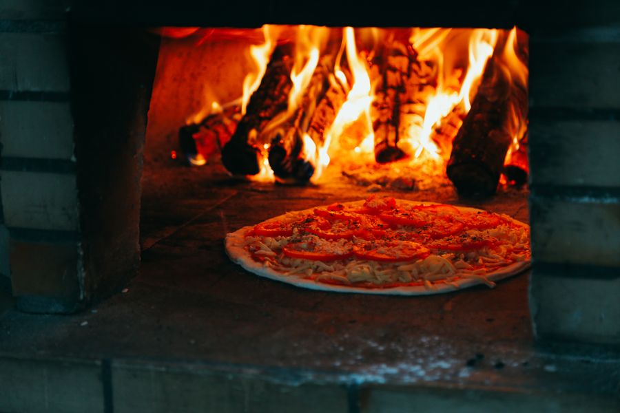 Flatbread cooking in a wood-fired oven